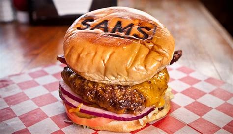 Sams burger joint - Specialties: Popular burgers include the Guac Jack, Mushroom Swiss and Bacon Cheddar. We feature homemade onion rings and fried mushrooms Veggie burgers too! Established in 1999. Sam's Burger Joint has some of the biggest and best burgers in town! We also feature a live music hall featuring national and local acts. (the Music Hall has different …